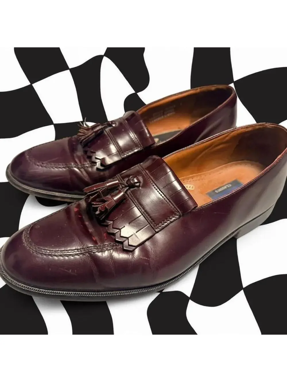 Bostonian Burgundy leather tassel loafers with a classic wingtip design.